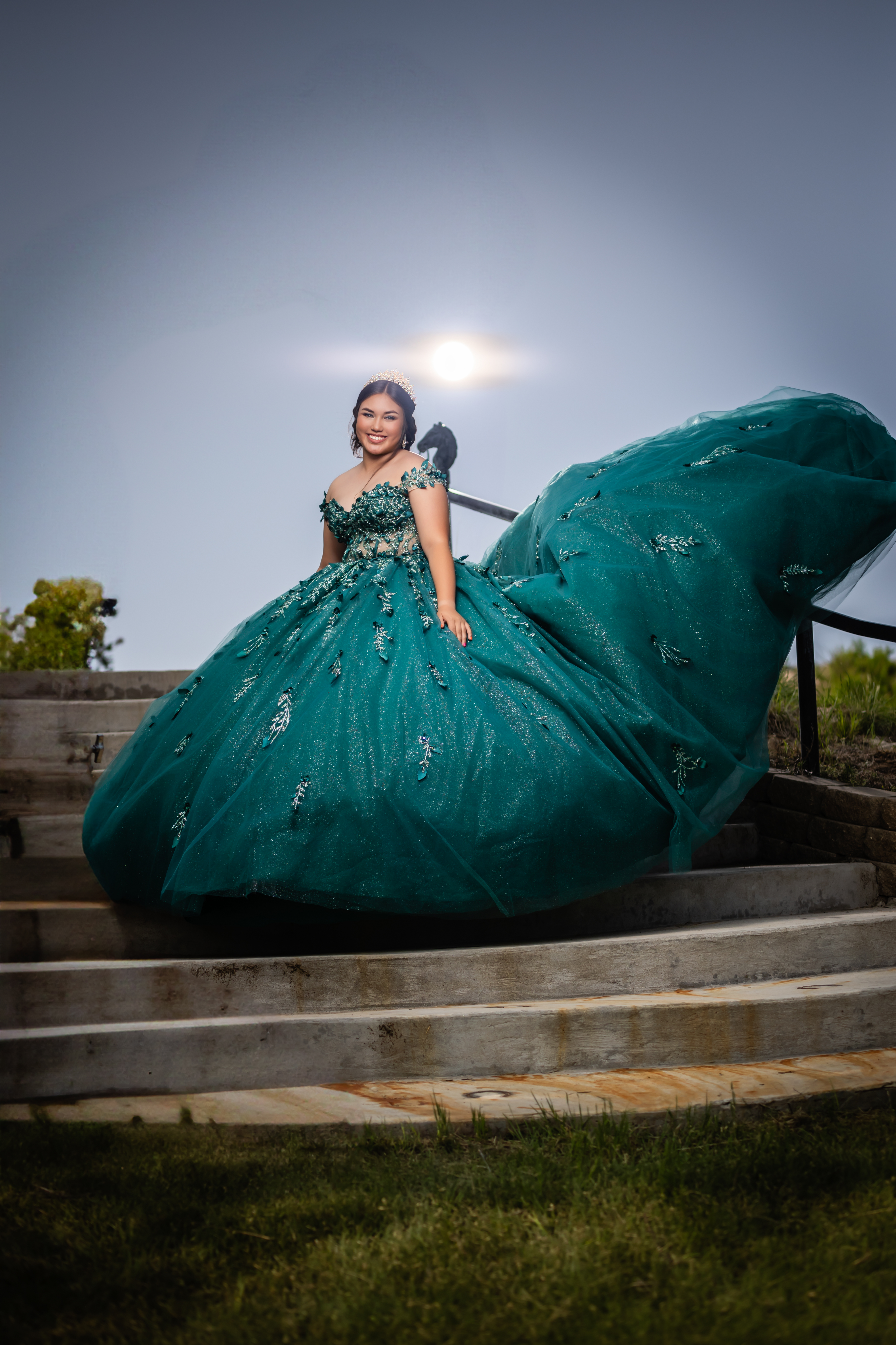 young lady on a beautiful outdoor staircase in her dress